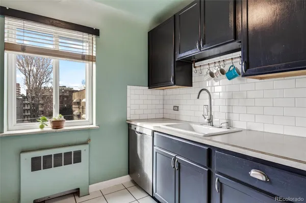 a kitchen with a sink and a window
