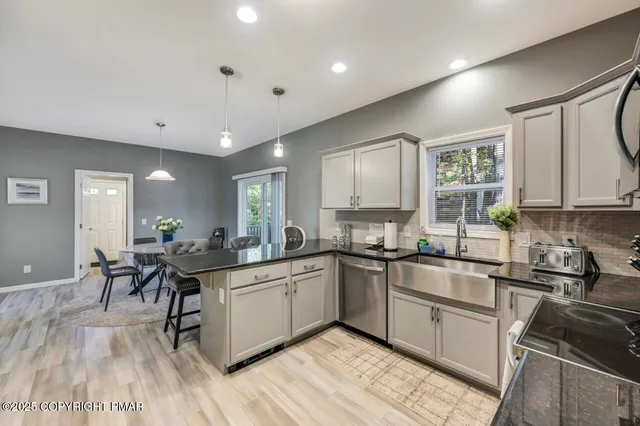 a kitchen with lots of counter top space and dining table