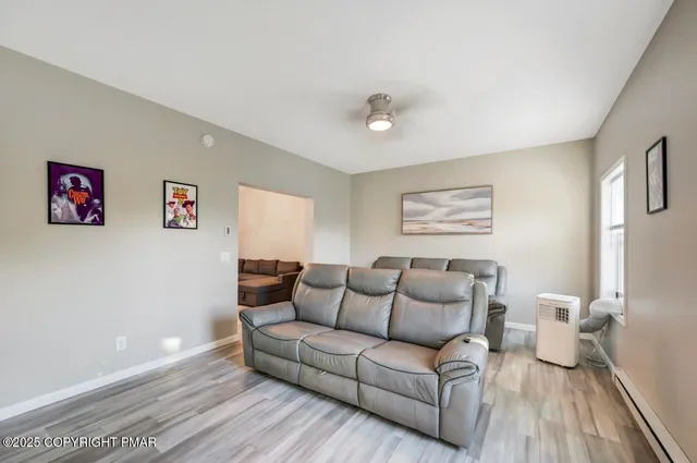 a view of entryway with a chandelier fan