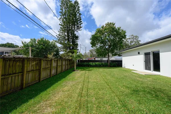 a view of backyard with green space