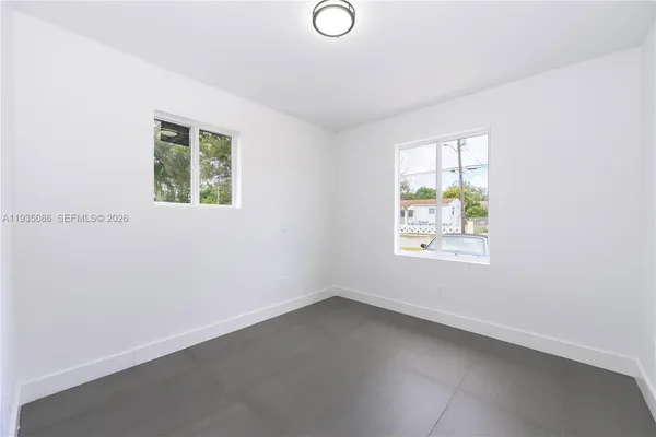 an empty room with windows