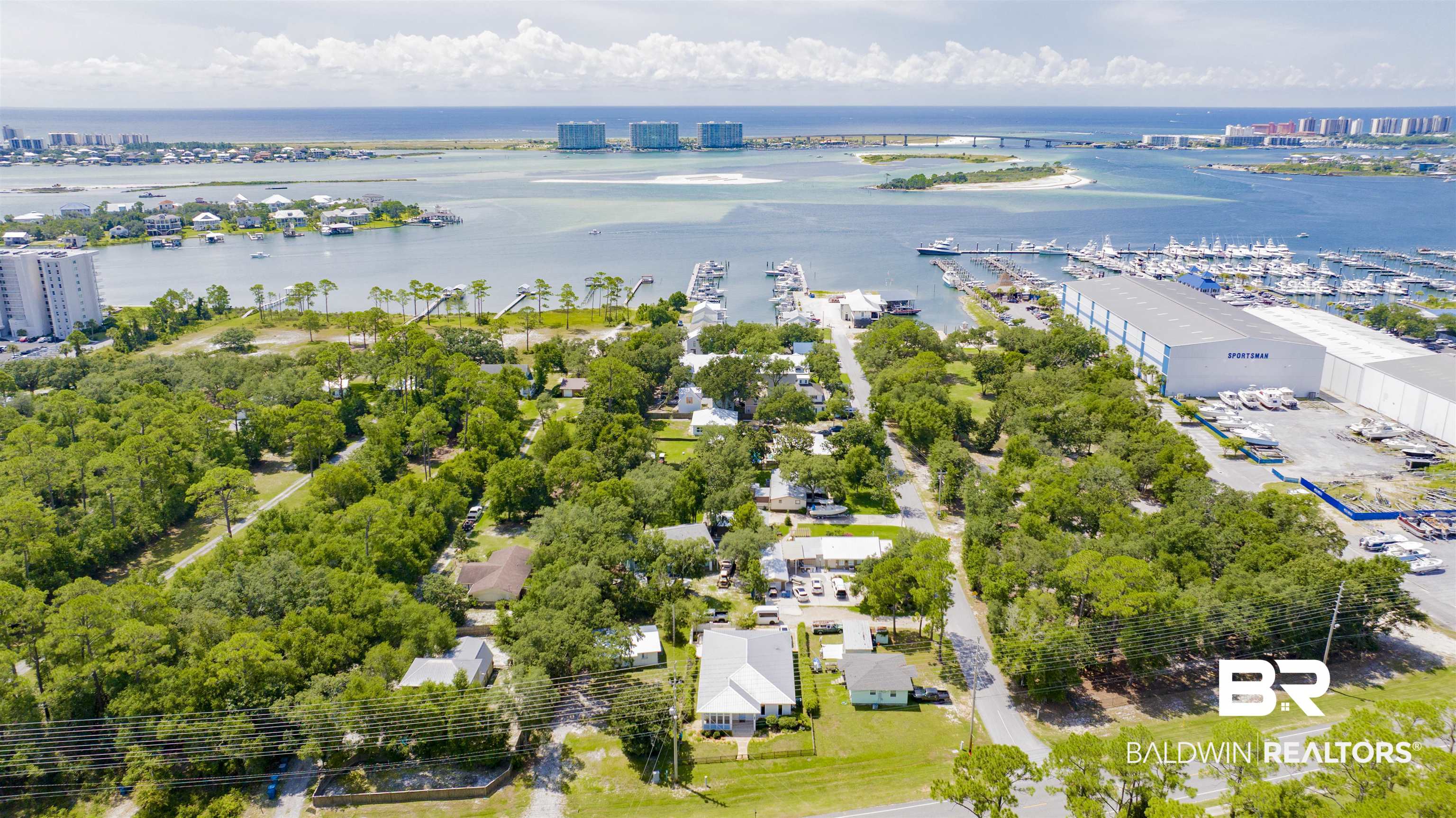 27980 Canal Road Orange Beach, AL 36561 - Photo 8 of 46 Drone / aerial view of numerous boat docks and a large body of water