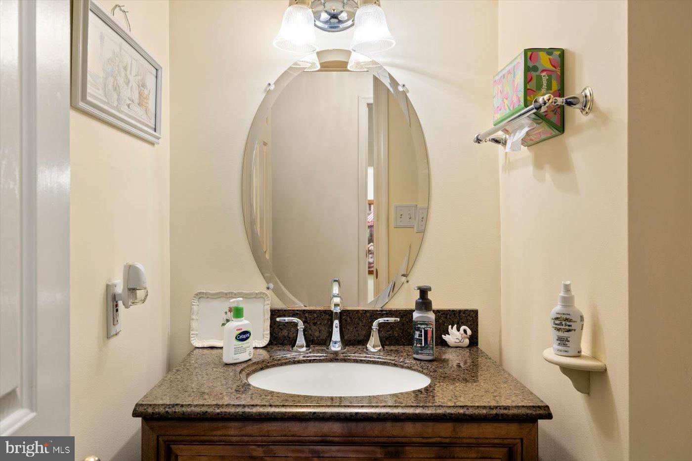 8472 Colfax Drive King George, VA 22485 - Photo 13 of 62 a bathroom with a sink and a mirror