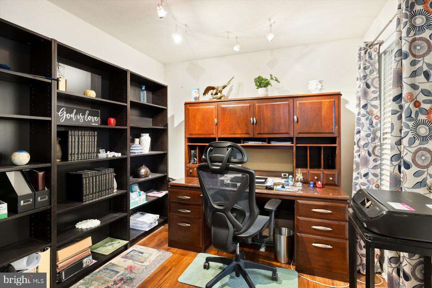 8472 Colfax Drive King George, VA 22485 - Photo 23 of 62 a view of workspace with furniture and book shelf