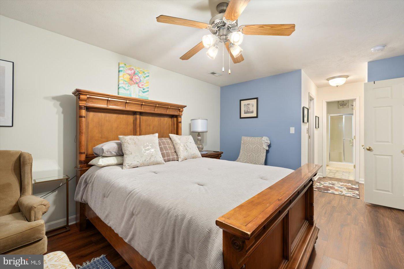 8472 Colfax Drive King George, VA 22485 - Photo 25 of 62 a bed room with a bed and a chandelier