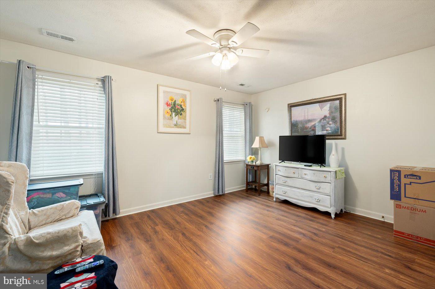 8472 Colfax Drive King George, VA 22485 - Photo 27 of 62 a living room with furniture and a flat screen tv