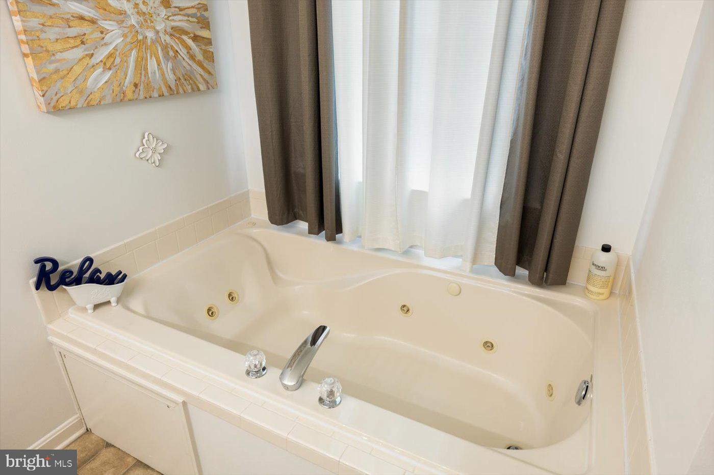 8472 Colfax Drive King George, VA 22485 - Photo 30 of 62 a bathroom with a tub and a sink