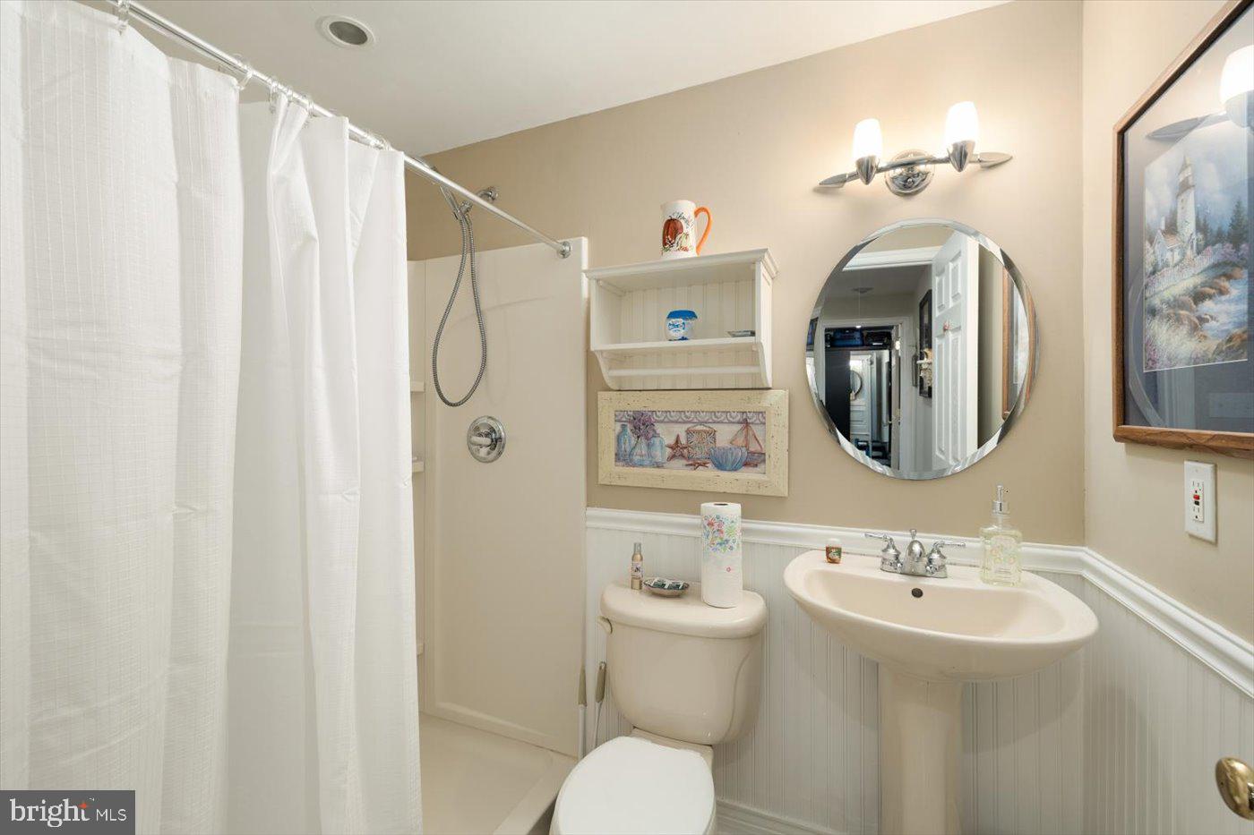 8472 Colfax Drive King George, VA 22485 - Photo 34 of 62 a bathroom with a sink toilet and shower