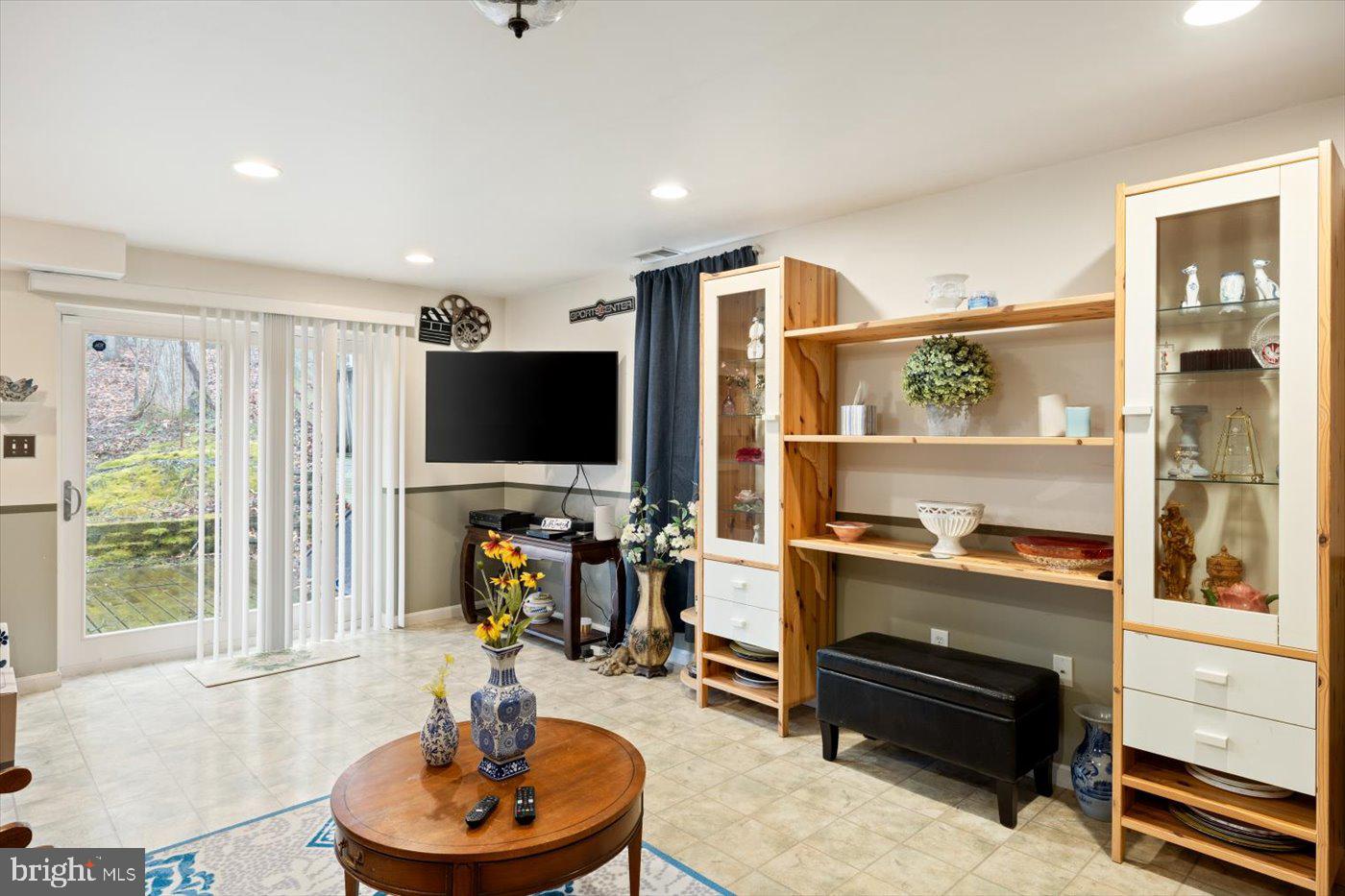 8472 Colfax Drive King George, VA 22485 - Photo 35 of 62 a living room with furniture and a flat screen tv