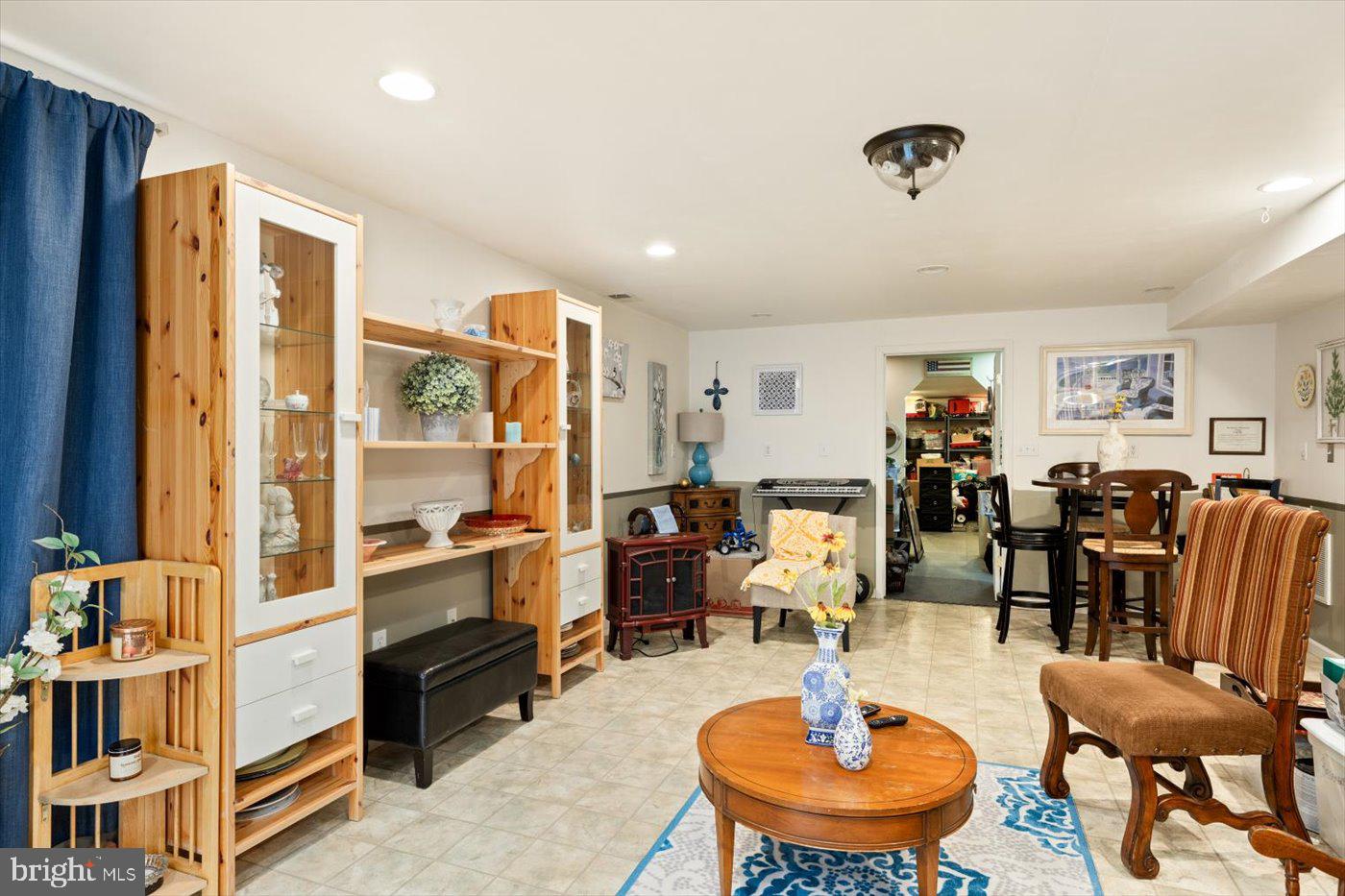 8472 Colfax Drive King George, VA 22485 - Photo 36 of 62 a living room with furniture a rug and a large window