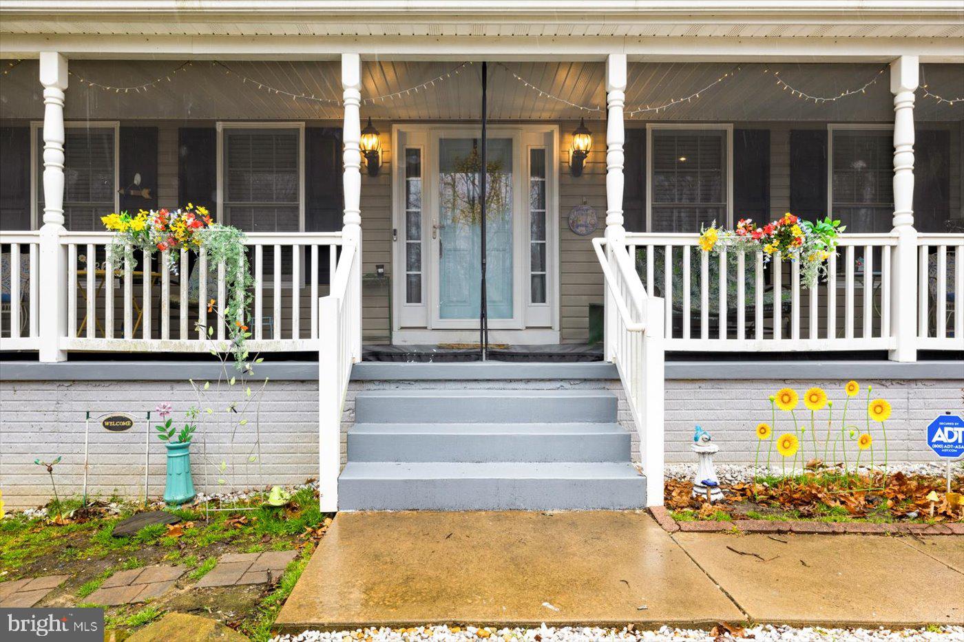 8472 Colfax Drive King George, VA 22485 - Photo 4 of 62 a front view of a house with a porch