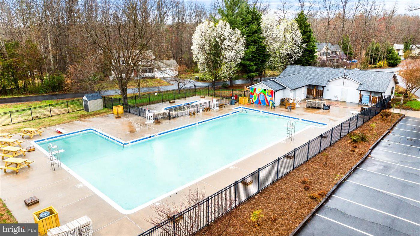 8472 Colfax Drive King George, VA 22485 - Photo 44 of 62 a view of a swimming pool with a patio and a yard