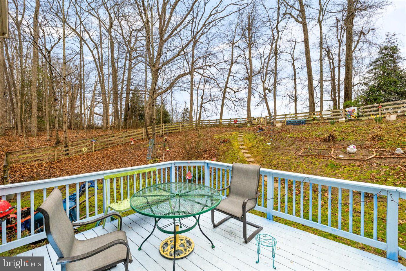 8472 Colfax Drive King George, VA 22485 - Photo 56 of 62 a view of a chair and table on the deck