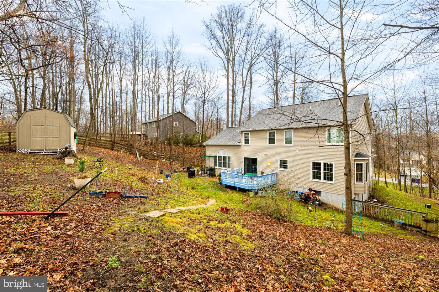 8472 Colfax Drive King George, VA 22485 - Photo 61 of 62 a view of a house with a yard patio and fire pit