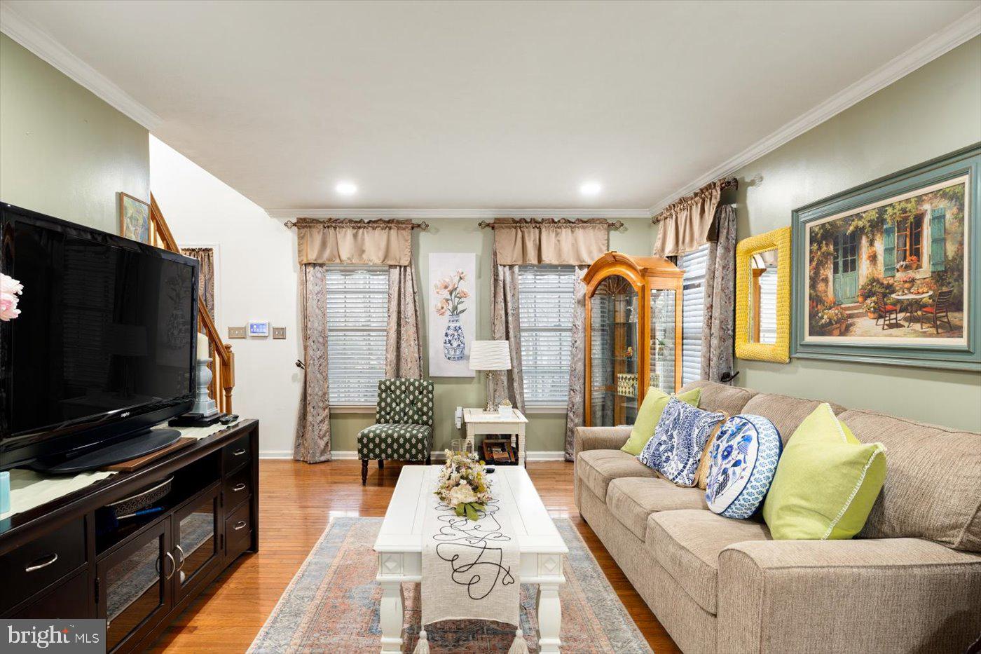 8472 Colfax Drive King George, VA 22485 - Photo 8 of 62 a living room with furniture and a flat screen tv
