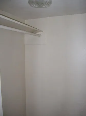 a white toilet sitting in front of a window