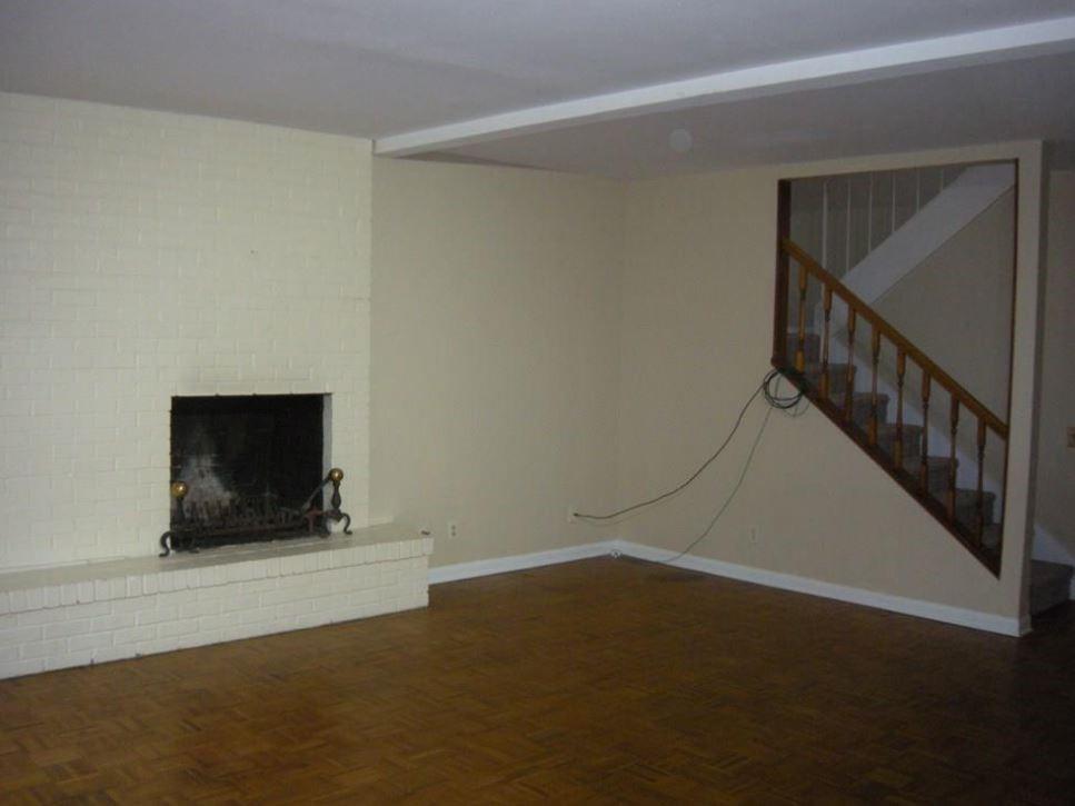2704 San Pedro Street, Unit 2 Austin, TX 78705 - Photo 7 of 16 a view of a livingroom with an empty space and a fireplace