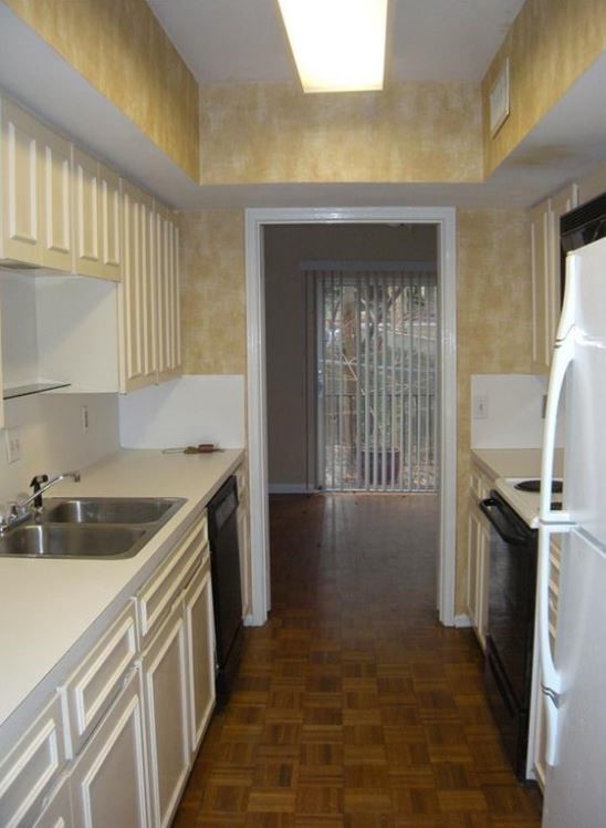 2704 San Pedro Street, Unit 2 Austin, TX 78705 - Photo 8 of 23 a kitchen with a sink stove and cabinets