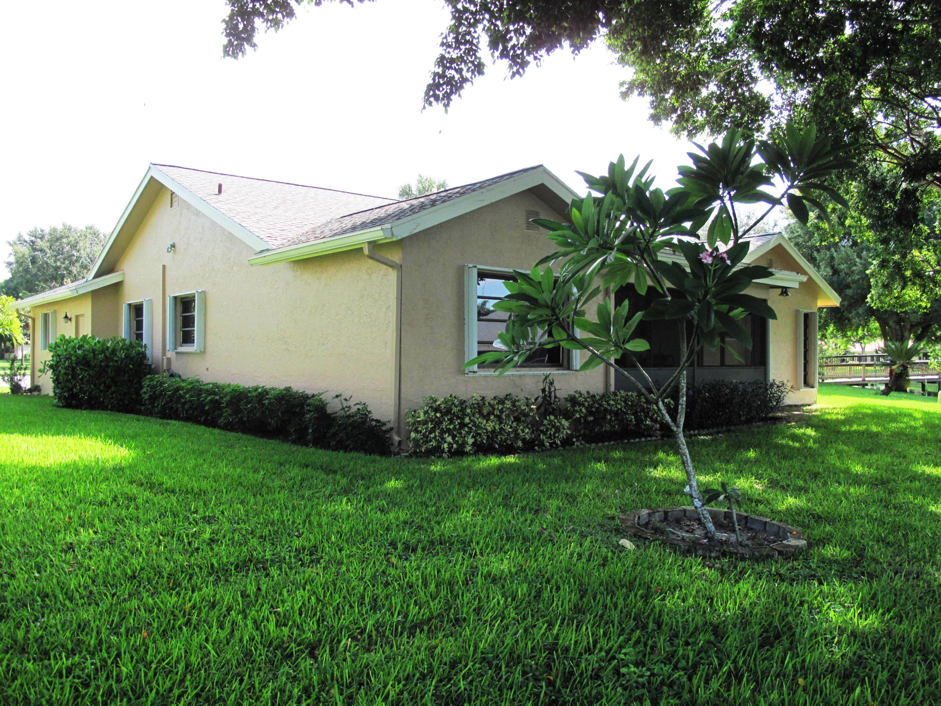 10740 180th Place South Boca Raton, FL 33498 - Photo 27 of 59 Back view of home with large shade tree