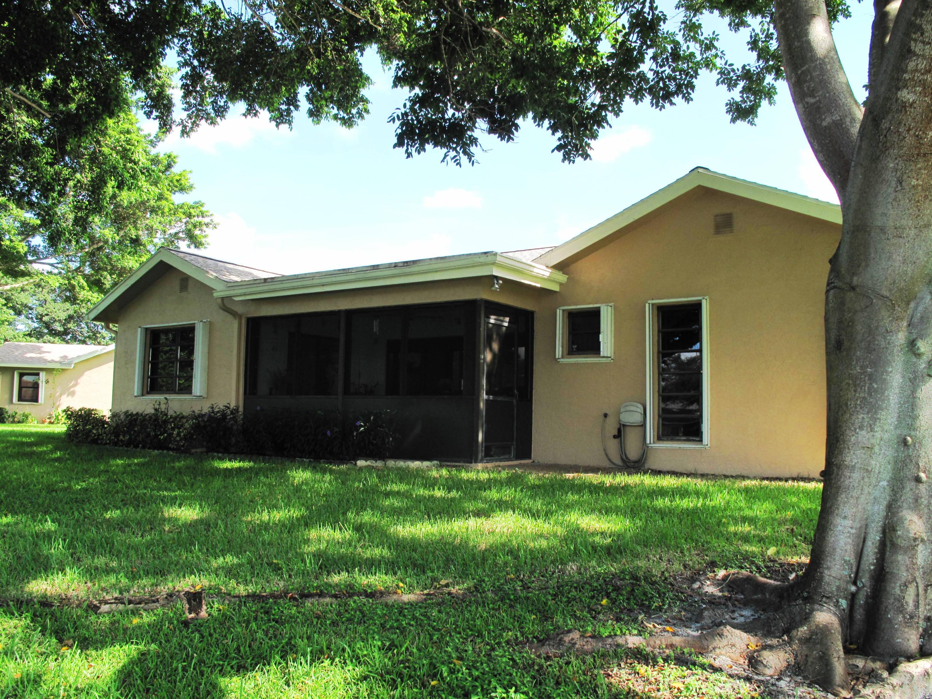 10740 180th Place South Boca Raton, FL 33498 - Photo 30 of 59 Back view of home with large shade tree