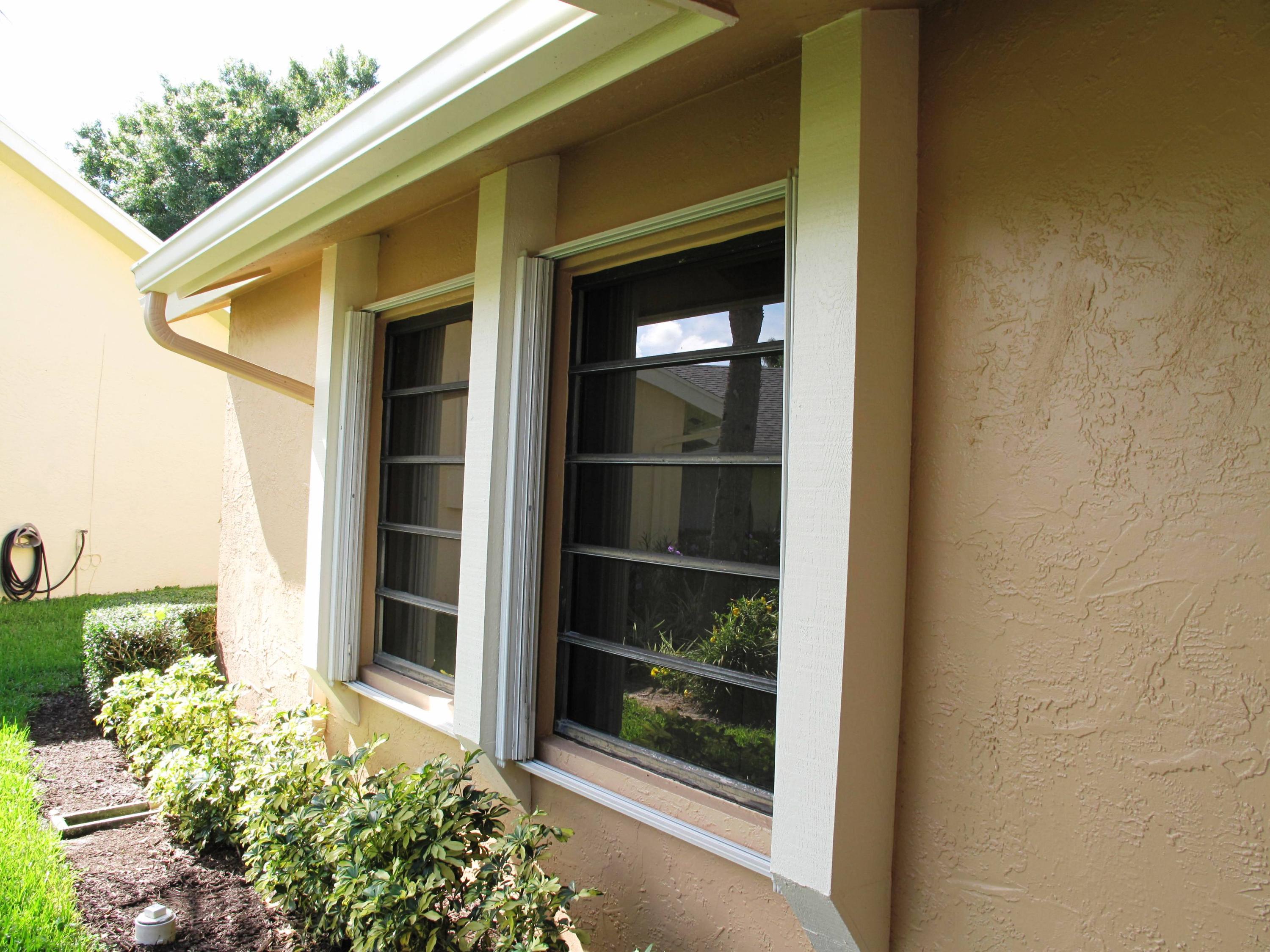 10740 180th Place South Boca Raton, FL 33498 - Photo 5 of 59 Accordian shutters on windows