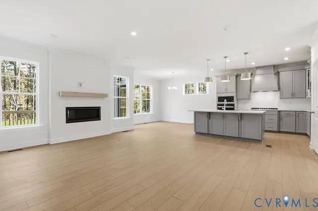 a view of a kitchen with a sink cabinets and a fireplace