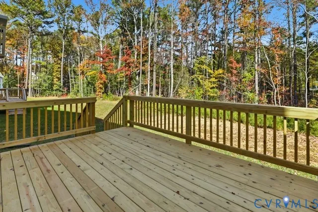 a view of balcony with wooden floor