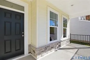 a view of a house with a door and wooden floor