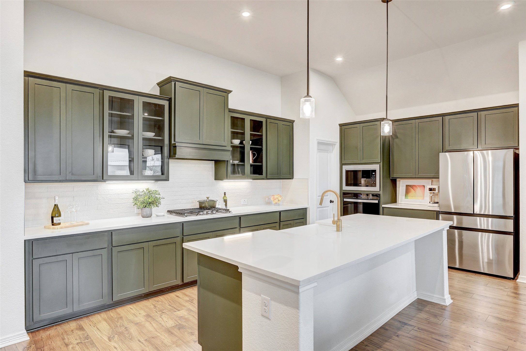 1117 Spring Gulch Lane Georgetown, TX 78628 - Photo 11 of 39 Culinary delights await in this bright kitchen with modern appliances and an inviting central island.