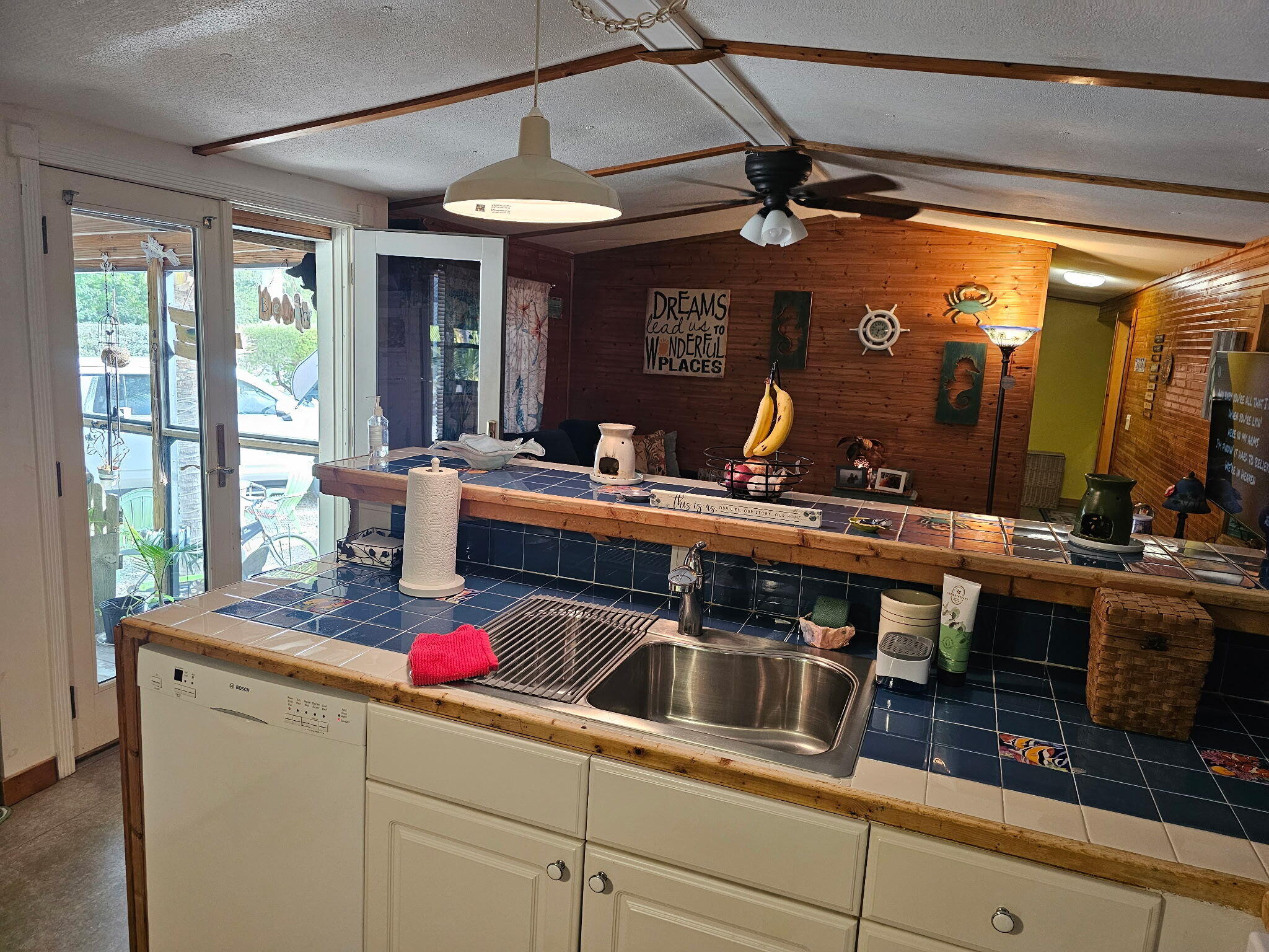 27997 Coral Shores Road Summerland Key, FL 33042 - Photo 14 of 28 a kitchen with a sink stove and cabinets