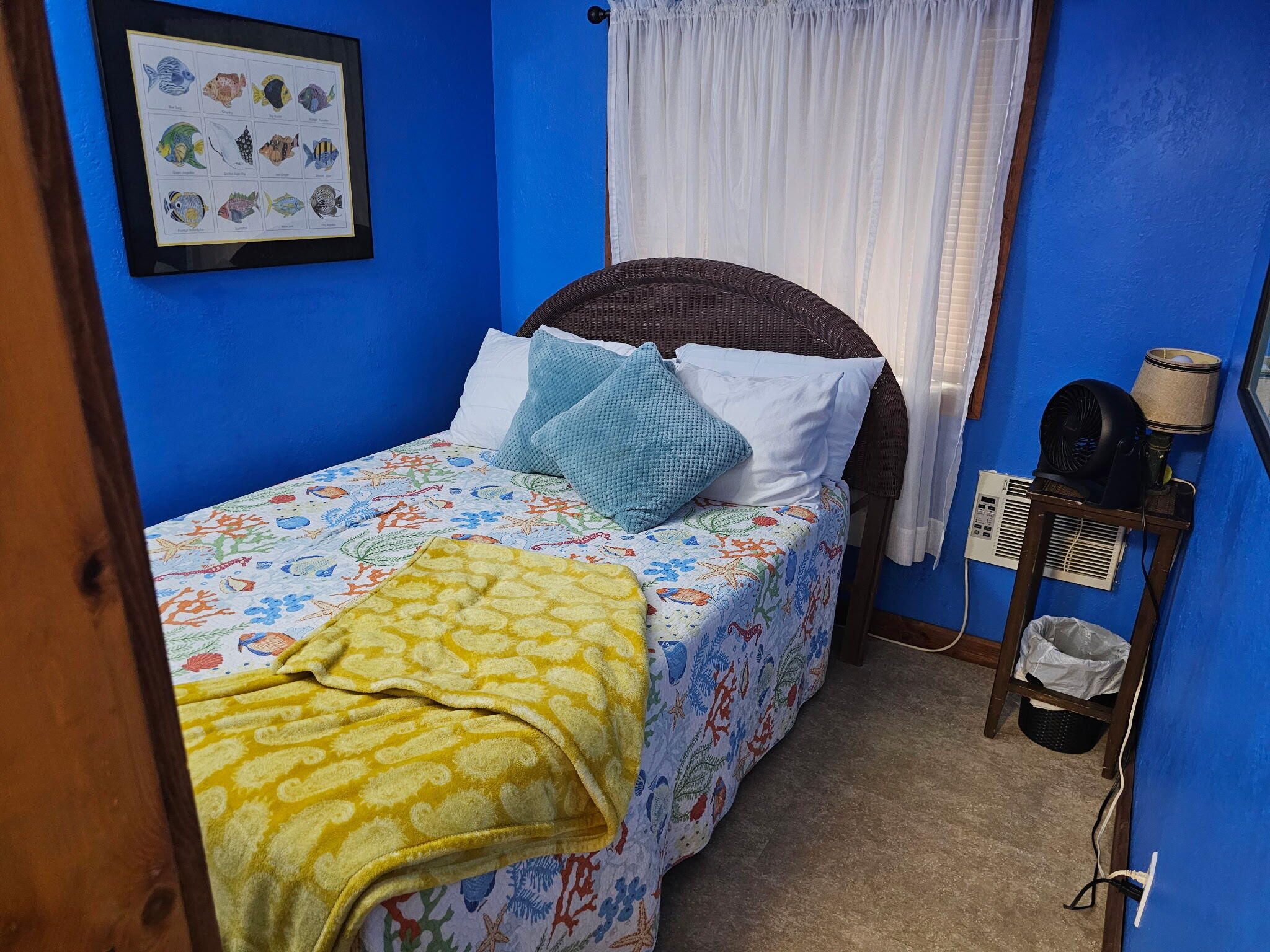 27997 Coral Shores Road Summerland Key, FL 33042 - Photo 16 of 28 a bed sitting in a bedroom next to a cabinet