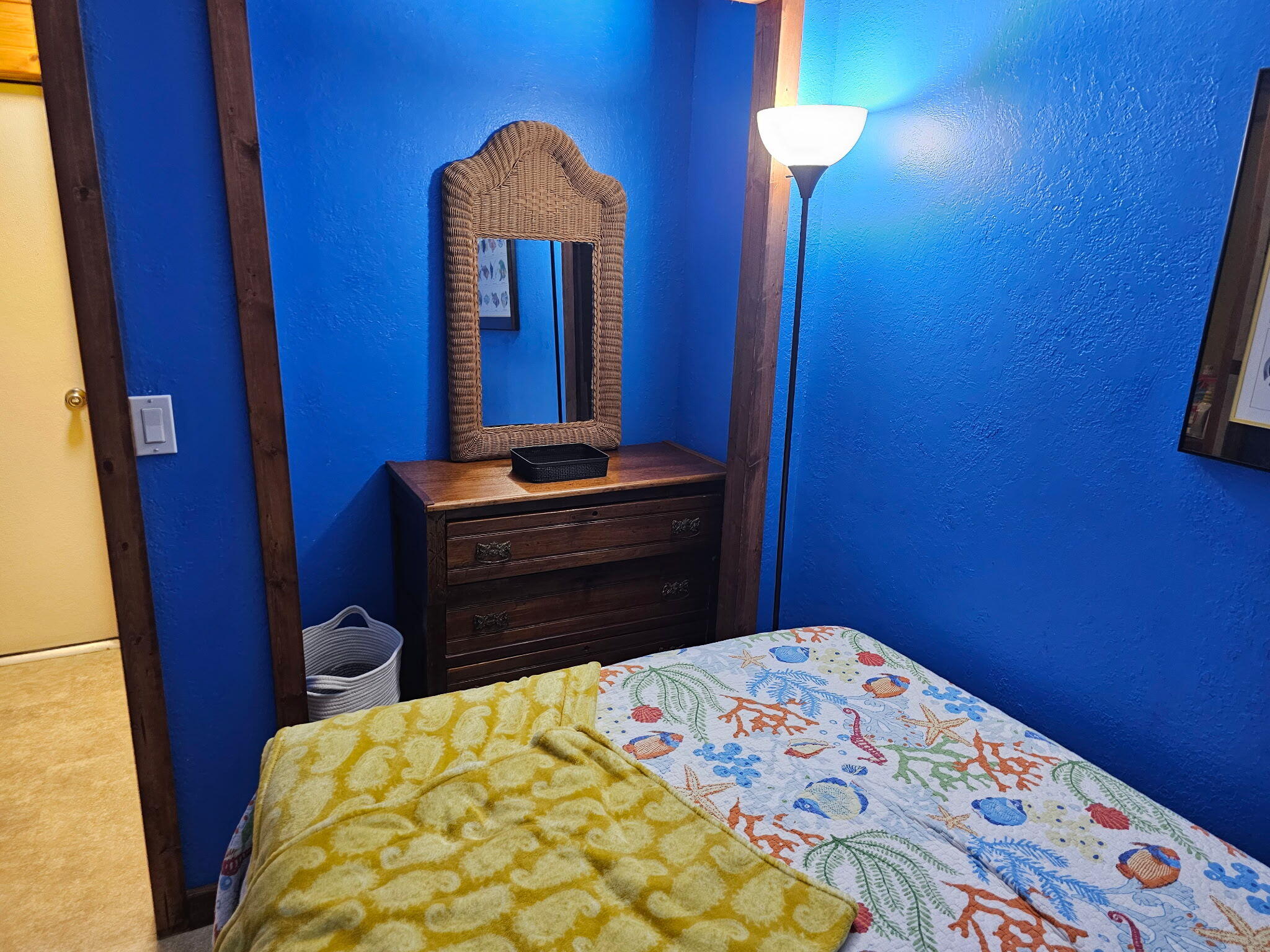 27997 Coral Shores Road Summerland Key, FL 33042 - Photo 17 of 28 a bedroom with a bed and a lamp on dresser