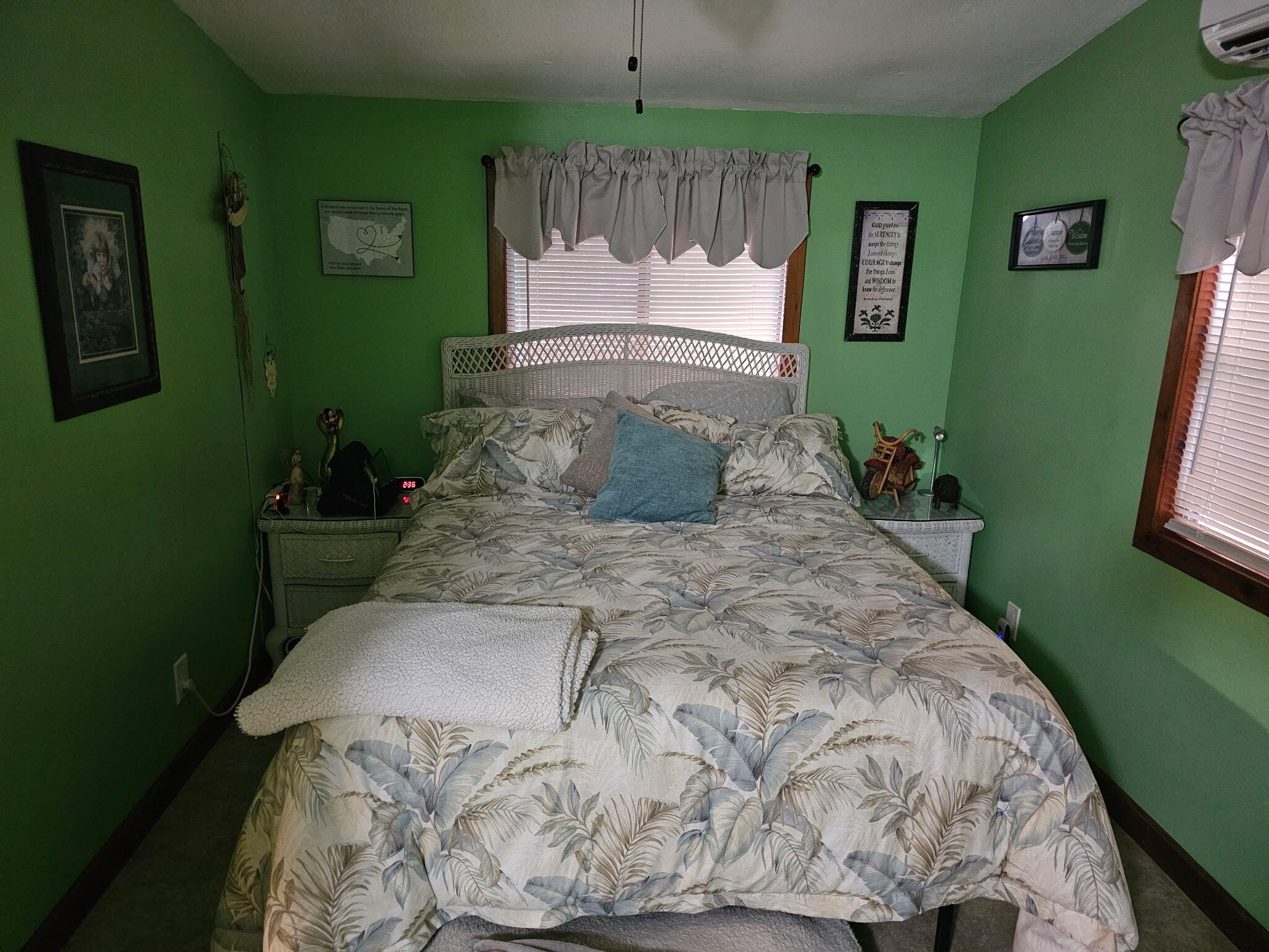 27997 Coral Shores Road Summerland Key, FL 33042 - Photo 23 of 28 a bed sitting in a bedroom next to a large mirror