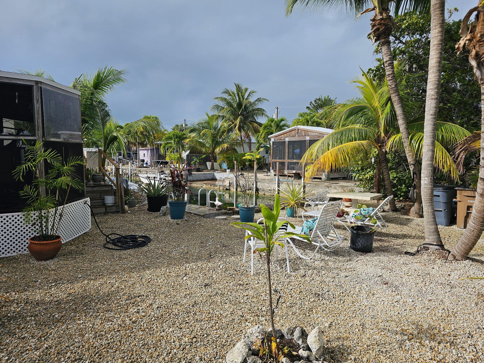 27997 Coral Shores Road Summerland Key, FL 33042 - Photo 3 of 28 a view of a backyard with sitting area