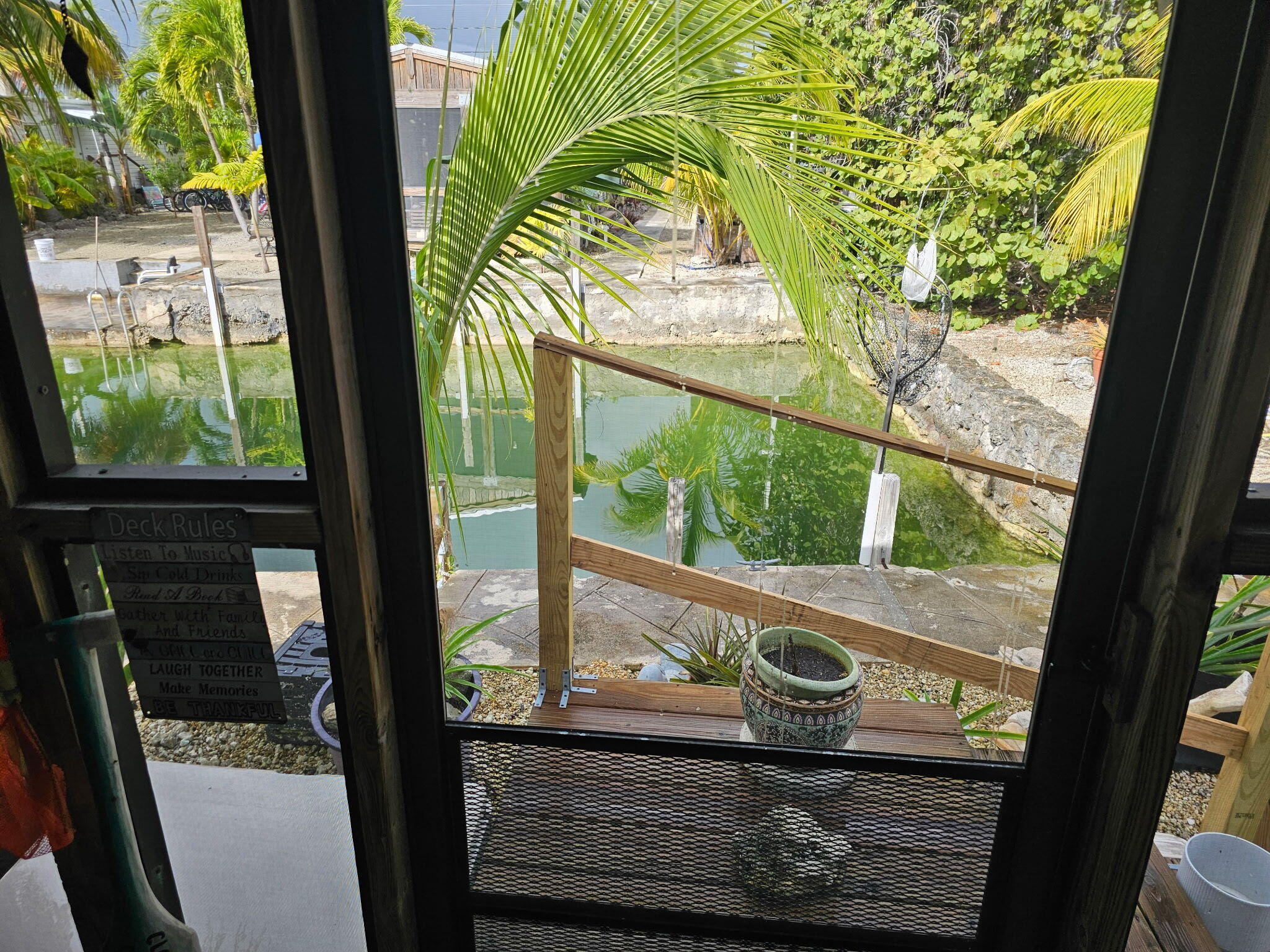 27997 Coral Shores Road Summerland Key, FL 33042 - Photo 4 of 28 a view of a glass door with a balcony from a window