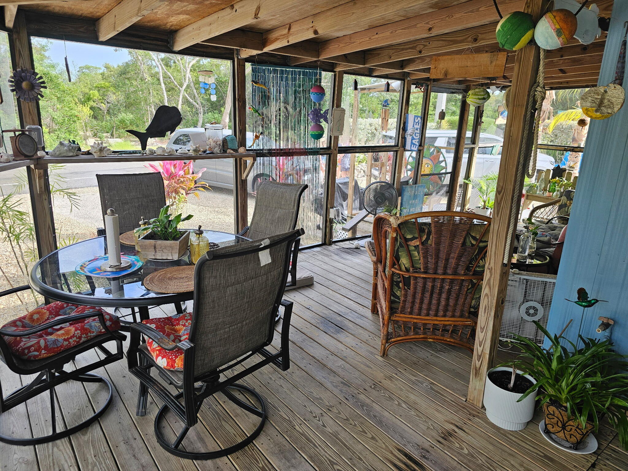 27997 Coral Shores Road Summerland Key, FL 33042 - Photo 6 of 28 a dining room with furniture water view and wooden floor