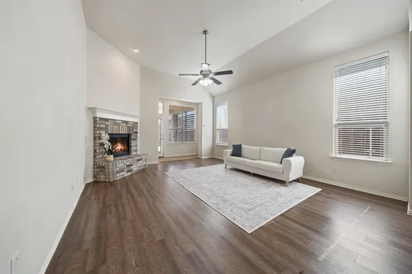 a living room with furniture and a fireplace
