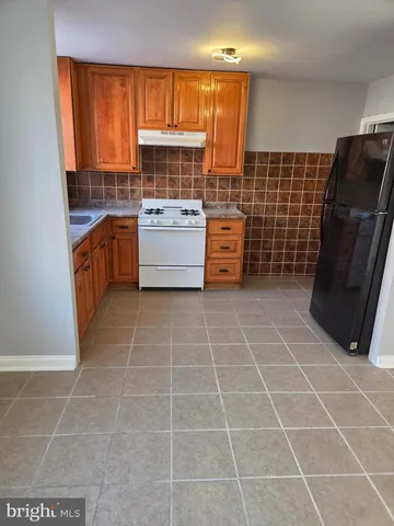 a bathroom with a sink a toilet and a shower