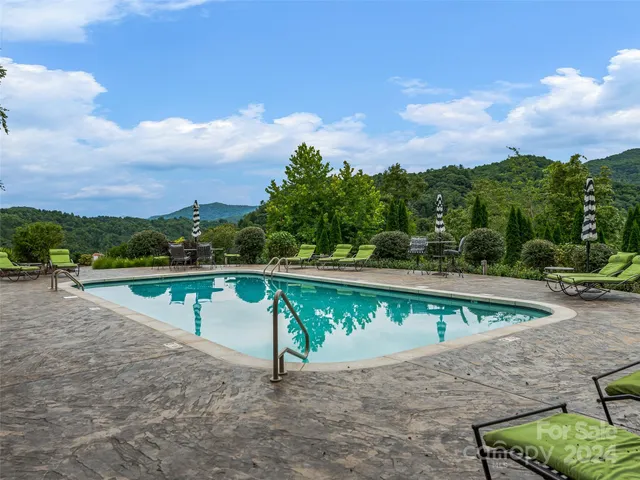 a view of house with backyard space and balcony