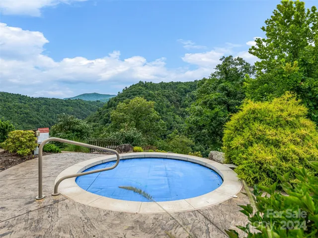 a view of a patio with a table and chairs