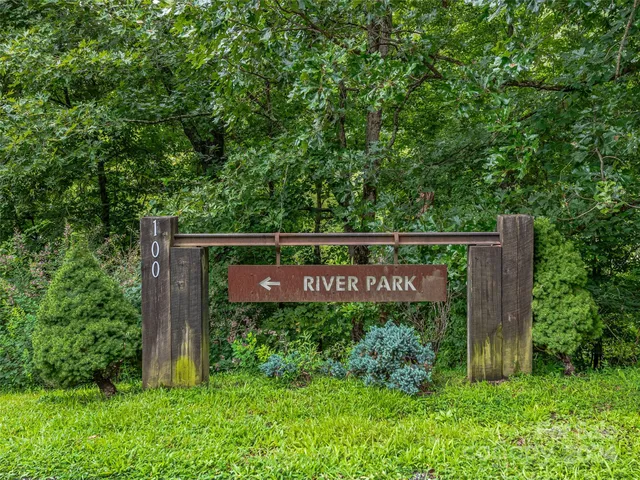 a view of a park with large trees
