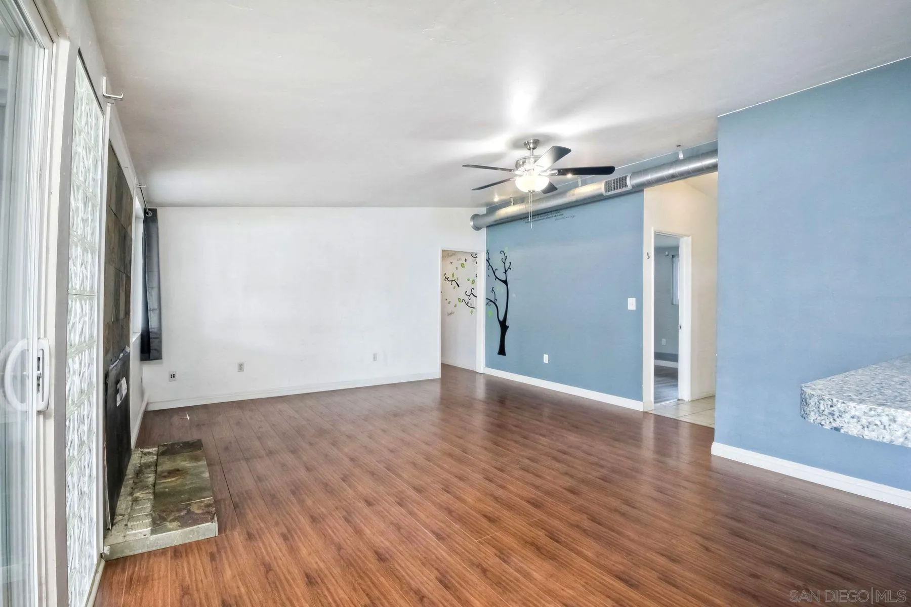 13816 Tobiasson Road Poway, CA 92064 - Photo 6 of 37 a view of a livingroom with wooden floor