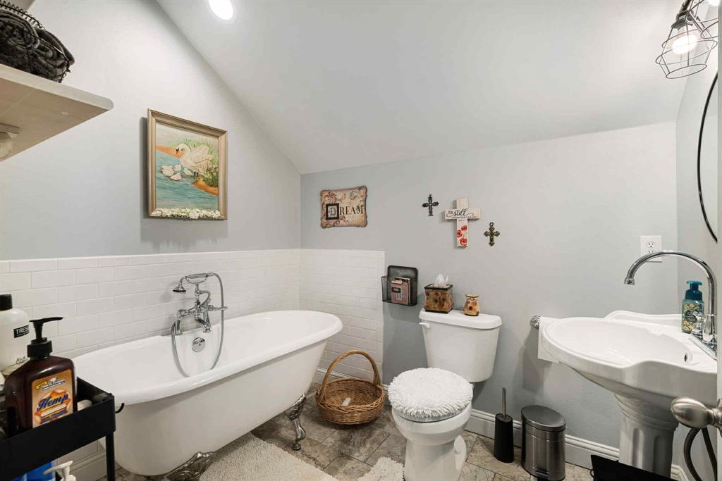 2205 County Road Blossom, TX 75416 - Photo 19 of 27 Bathroom featuring a stall shower, vanity, and light tile patterned floors