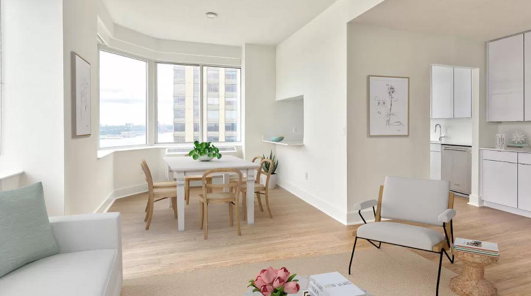180 Riverside Boulevard, Unit 609 Manhattan, NY 10069 - Photo 2 of 9 a dining room with furniture and wooden floor