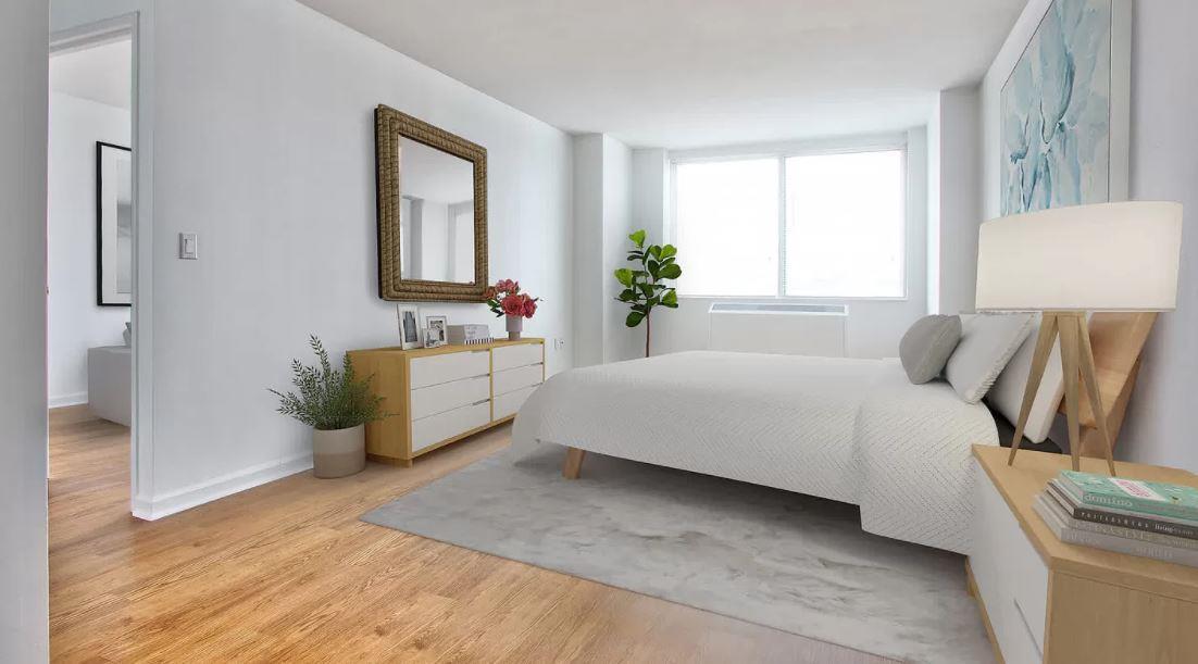 180 Riverside Boulevard, Unit 609 Manhattan, NY 10069 - Photo 3 of 9 a spacious bedroom with a bed and a window