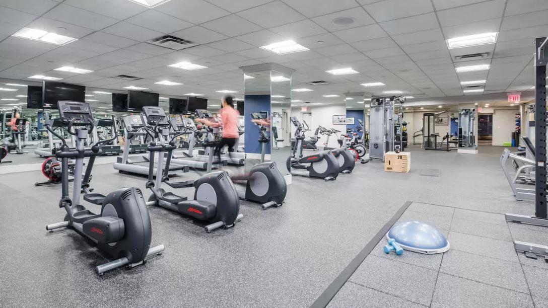 180 Riverside Boulevard, Unit 609 Manhattan, NY 10069 - Photo 5 of 9 a view of a room with gym equipment