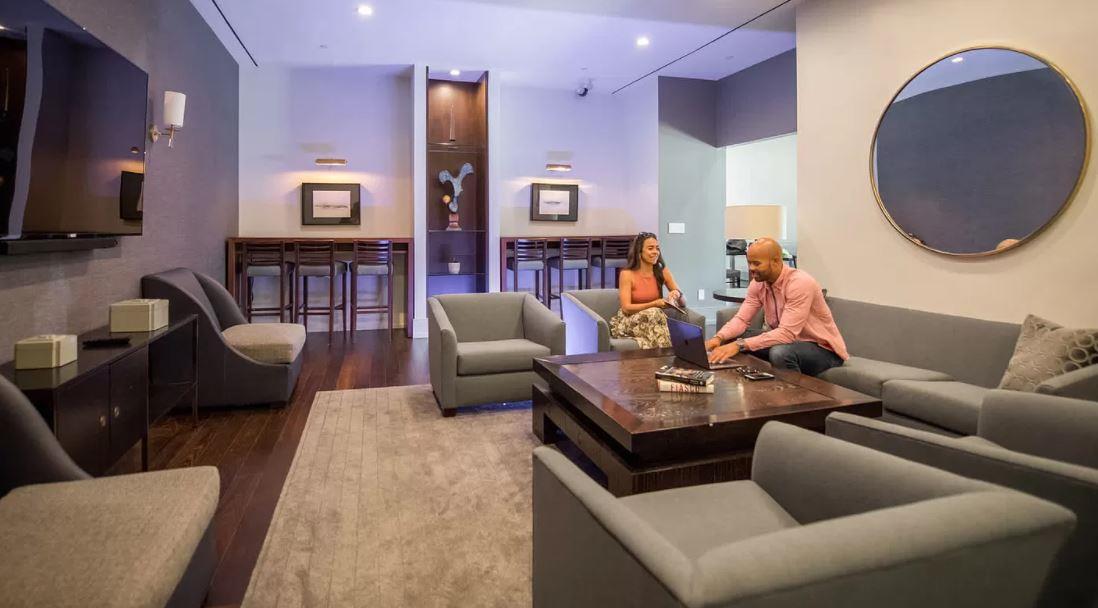 180 Riverside Boulevard, Unit 609 Manhattan, NY 10069 - Photo 6 of 9 a living room with furniture and a flat screen tv