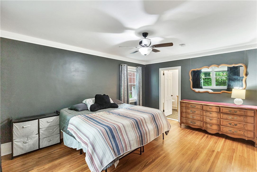 25 Central Avenue Honea Path, SC 29654 - Photo 13 of 36 This spacious room features ample natural light and durable flooring, offering a comfortable living space.