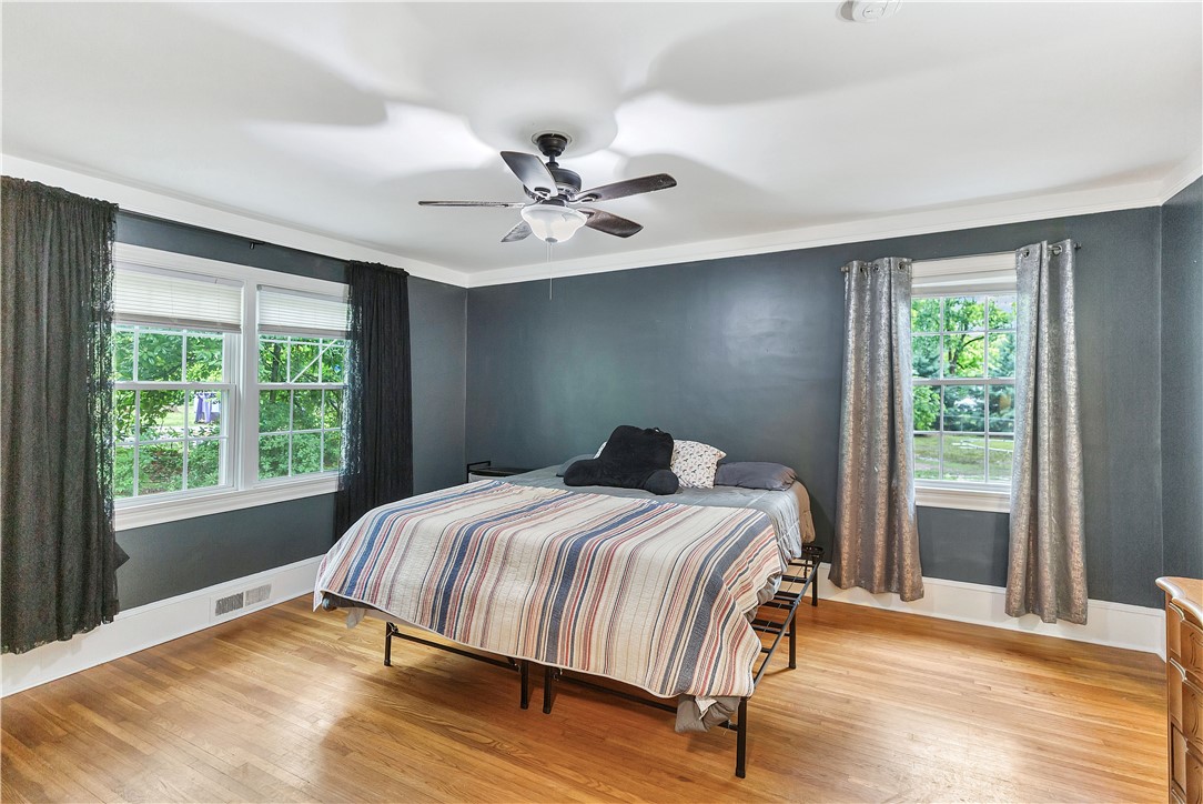 25 Central Avenue Honea Path, SC 29654 - Photo 14 of 36 This inviting bedroom features hardwood flooring and abundant natural light.