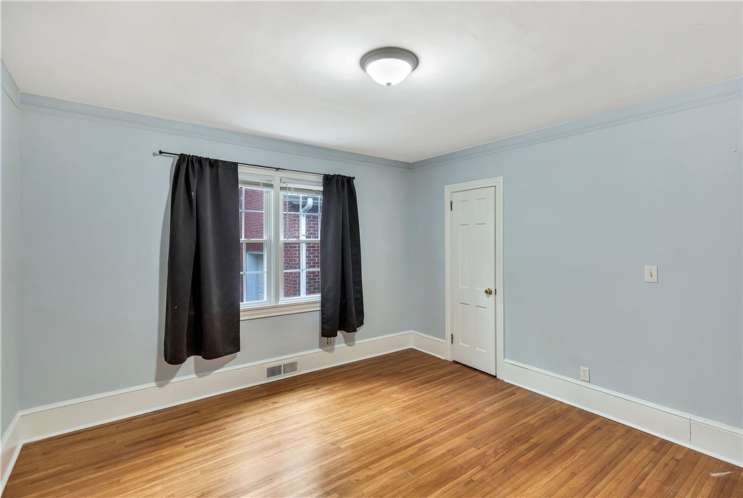 25 Central Avenue Honea Path, SC 29654 - Photo 17 of 36 This spacious bedroom offers gleaming hardwood floors and ample natural light.